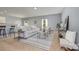 Bright living room with modern furnishings, neutral color scheme, and ample natural light at 7209 Cuddington Dr, Charlotte, NC 28215