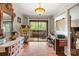 Bright dining room with hardwood floors, a decorative chandelier, and a view of the outdoor patio at 7329 Winery Ln, Charlotte, NC 28227