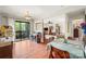 Open concept dining room flowing into the living room, featuring hardwood floors and a patio view at 7329 Winery Ln, Charlotte, NC 28227