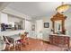 Cozy dining area with hardwood floors and view into the kitchen with stainless steel appliances at 7329 Winery Ln, Charlotte, NC 28227