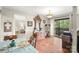 Elegant dining room with hardwood floors, a chandelier, and sliding glass doors to the patio at 7329 Winery Ln, Charlotte, NC 28227