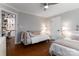 Cozy bedroom with hardwood floors, natural light, and two twin beds at 7600 Dunsmuir Ct, Cornelius, NC 28031