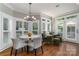 Sunlit breakfast nook with chandelier, multiple windows and room for seating at 7600 Dunsmuir Ct, Cornelius, NC 28031