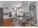 Updated kitchen features granite countertops, stainless steel appliances and gas cooktop at 7600 Dunsmuir Ct, Cornelius, NC 28031