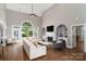 Inviting living room featuring a fireplace, built-in shelving, and ample natural light at 7600 Dunsmuir Ct, Cornelius, NC 28031