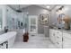 Beautiful bathroom features large, glass shower, soaking tub, and white marble tiling at 7600 Dunsmuir Ct, Cornelius, NC 28031