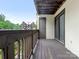 Spacious balcony featuring a wooden floor and railing, perfect for outdoor relaxation at 8183 Cedar Glen Dr, Charlotte, NC 28212