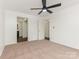 Bedroom with neutral carpet and access to a bathroom and closet at 8183 Cedar Glen Dr, Charlotte, NC 28212