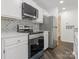 Well-equipped kitchen boasting stainless steel appliances and stylish backsplash tiles at 8183 Cedar Glen Dr, Charlotte, NC 28212