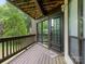 Inviting porch entrance featuring a wooden deck, door, and a welcome mat at 8183 Cedar Glen Dr, Charlotte, NC 28212