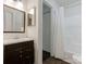 Bathroom with a vanity and framed mirror, plus a shower and tub with white shower curtain at 8202 Cedar Glen Dr, Charlotte, NC 28212