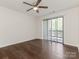 Comfortable bedroom with sliding glass doors that leads to the outdoor balcony at 8202 Cedar Glen Dr, Charlotte, NC 28212