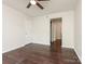 Spacious bedroom with ceiling fan, hardwood floors, and a neutral color scheme at 8202 Cedar Glen Dr, Charlotte, NC 28212