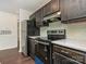 Well-lit kitchen with stainless steel appliances, stylish countertops, and modern backsplash at 8202 Cedar Glen Dr, Charlotte, NC 28212