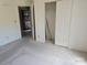 Empty bedroom with closet and entry door at 854 Southwest Dr, Davidson, NC 28036
