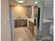 Efficient kitchen with laminate countertops, wood cabinets, and white appliances at 854 Southwest Dr, Davidson, NC 28036