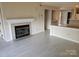 Spacious living room featuring fireplace, laminate floors and access to other rooms at 854 Southwest Dr, Davidson, NC 28036