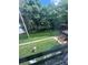 View of the backyard from a window, showing lush greenery and a private outdoor space at 921 Nottingham Dr # 6, Gastonia, NC 28054