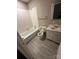 This bathroom is equipped with a bathtub, toilet and vanity, needs some TLC at 921 Nottingham Dr # 6, Gastonia, NC 28054