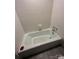 Vintage bathtub with tile surround, showcasing classic bathroom fixtures and design at 921 Nottingham Dr # 6, Gastonia, NC 28054