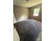 Bedroom featuring neutral walls, carpet flooring, and a window providing natural light at 921 Nottingham Dr # 6, Gastonia, NC 28054