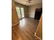 Bright dining area featuring wood-look floors, neutral walls, and a door leading to the outdoors at 921 Nottingham Dr # 6, Gastonia, NC 28054
