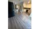View of kitchen featuring a brick fireplace, cabinets, and natural light streaming in from outdoors at 921 Nottingham Dr # 6, Gastonia, NC 28054
