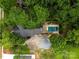 Aerial view of property featuring a private backyard oasis with a sparkling pool and lush greenery at 940 N New Hope Rd, Gastonia, NC 28054