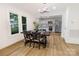 Open-concept dining room with modern light fixtures and stainless steel appliances in the adjacent kitchen at 940 N New Hope Rd, Gastonia, NC 28054