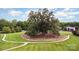 Aerial view of a massive tree, circle lawn and walking path at 9814 Tompkins Ln, Waxhaw, NC 28173