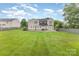 Spacious backyard features a green lawn and a wood fence at 9814 Tompkins Ln, Waxhaw, NC 28173