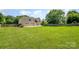 Expansive backyard featuring lush green grass, a spacious patio, and secure fencing, perfect for outdoor activities at 9814 Tompkins Ln, Waxhaw, NC 28173