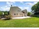 Spacious backyard featuring a lush lawn, patio, and privacy fence, ideal for outdoor living at 9814 Tompkins Ln, Waxhaw, NC 28173