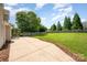 Spacious backyard featuring a concrete patio, a grill, and a well-maintained lawn area at 9814 Tompkins Ln, Waxhaw, NC 28173