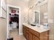 Bathroom featuring double sinks, large mirror, walk in closet at 9814 Tompkins Ln, Waxhaw, NC 28173