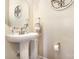 Bathroom featuring a pedestal sink, large mirror, and neutral decor at 9814 Tompkins Ln, Waxhaw, NC 28173