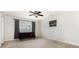 Bright bedroom features a ceiling fan, window and black futon at 9814 Tompkins Ln, Waxhaw, NC 28173