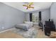 Cozy bedroom features a comfortable bed, a window with natural light, and a ceiling fan at 9814 Tompkins Ln, Waxhaw, NC 28173