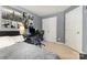 Functional bedroom with a bed, desk, and ample storage, offering a comfortable and practical living space at 9814 Tompkins Ln, Waxhaw, NC 28173