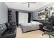Versatile bedroom with a bed, study area, and decorative wall art, designed for comfort and functionality at 9814 Tompkins Ln, Waxhaw, NC 28173