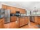 Spacious kitchen with stainless steel appliances, a center island, and wood cabinets at 9814 Tompkins Ln, Waxhaw, NC 28173