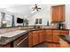 Bright kitchen features granite countertops, stainless steel appliances, and a ceiling fan at 9814 Tompkins Ln, Waxhaw, NC 28173