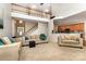 Spacious living room featuring a soaring ceiling, comfortable couches, and open layout to kitchen at 9814 Tompkins Ln, Waxhaw, NC 28173