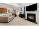 View of the living room showing the fireplace, and adjacent kitchen and dining area at 9814 Tompkins Ln, Waxhaw, NC 28173