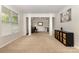 Spacious living room with neutral carpet, great natural lighting and modern decor at 9814 Tompkins Ln, Waxhaw, NC 28173