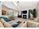 Bright and airy living room featuring a fireplace, neutral decor, and comfortable seating at 9814 Tompkins Ln, Waxhaw, NC 28173