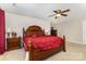 The main bedroom boasts a ceiling fan, wooden furniture and soft carpet at 9814 Tompkins Ln, Waxhaw, NC 28173