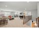 Large, bright bonus room featuring a foosball table and comfortable seating area at 9842 Quercus Ln, Huntersville, NC 28078