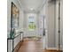 Inviting entryway with hardwood floors, a glass front door and neutral wall paint at 9842 Quercus Ln, Huntersville, NC 28078