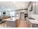 Modern kitchen with island, stainless steel appliances, and open layout for entertaining at 9842 Quercus Ln, Huntersville, NC 28078